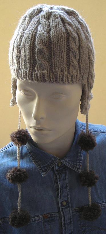 Cable Ear Flap Hat With Pom Poms Knitting Pattern